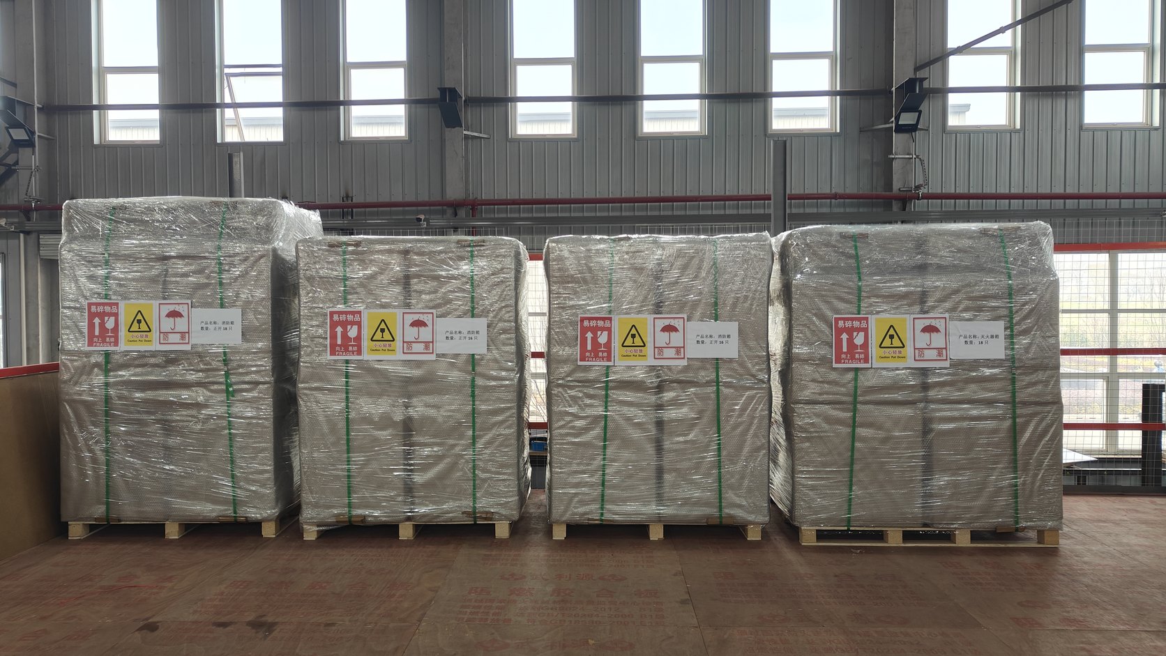 Fire cabinets palletised, stretch-wrapped and labelled fragile, ready for container loading at the SOKEI factory