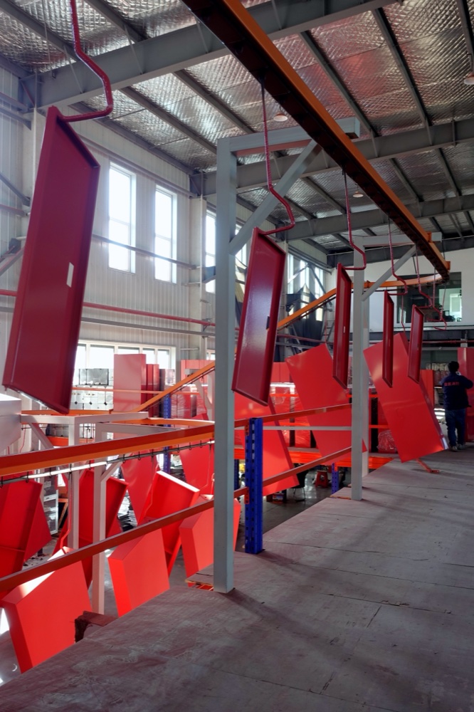 SOKEI red foam hydrant cabinet panels on the paint line at Jingjiang